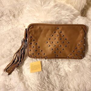Tan leather outside with silver studs,clutch,very very clean inside, like new
